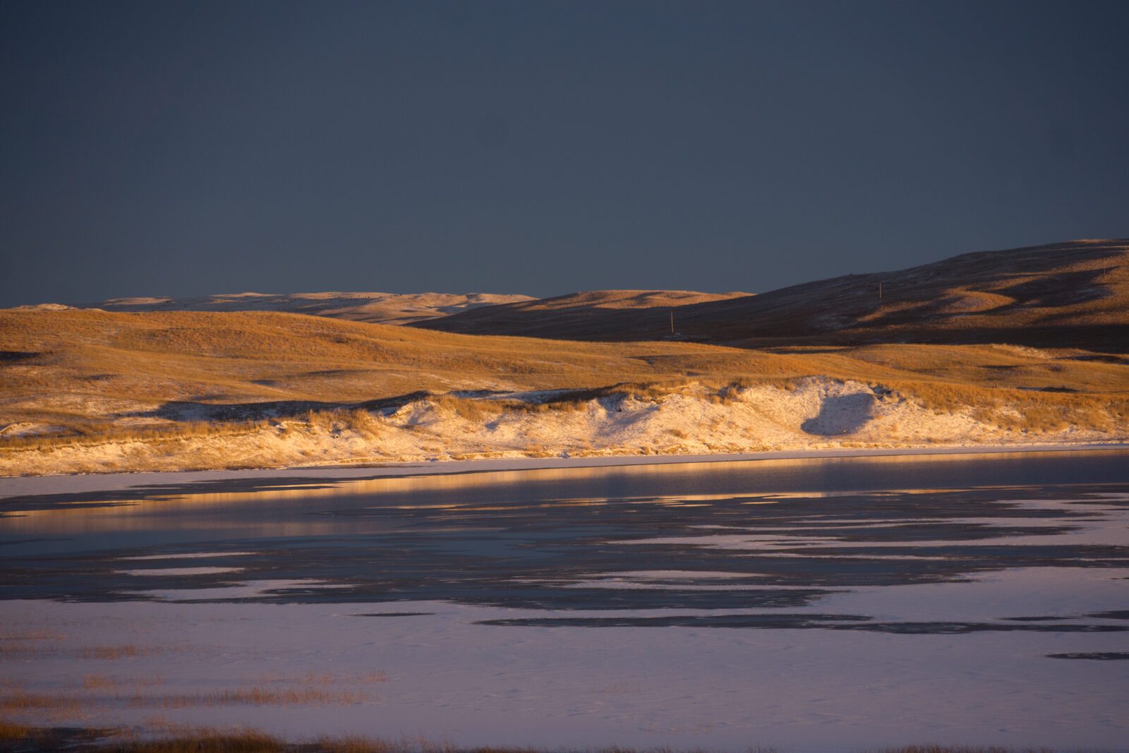 Frozen lake at sunset